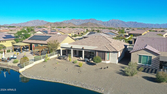 exterior space with a water and mountain view