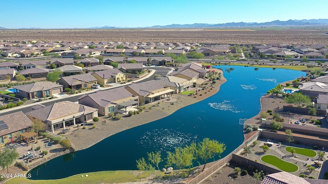 aerial view with a water and mountain view and a residential view