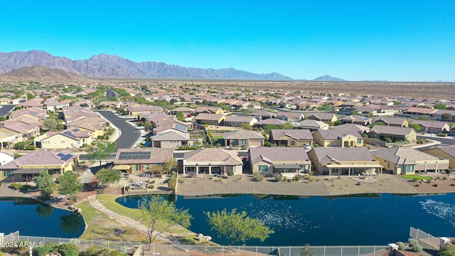 aerial view with a water and mountain view and a residential view