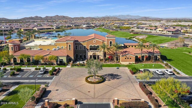 birds eye view of property with a residential view and a water and mountain view
