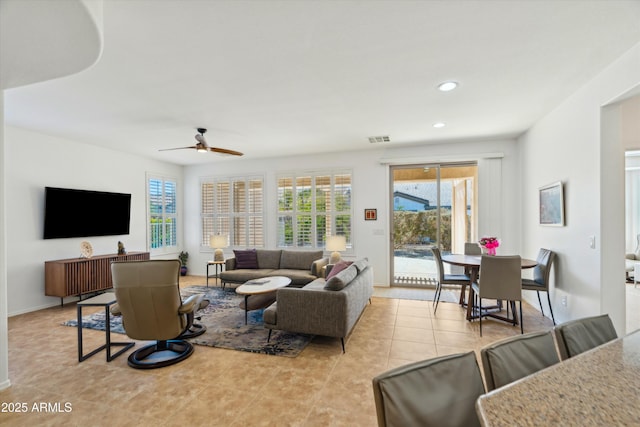 tiled living room featuring ceiling fan