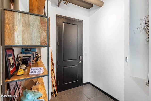 1 E Lexington Ave Unit 1209, Phoenix, AZ 85012 - entrance foyer with dark tile patterned floors and baseboards