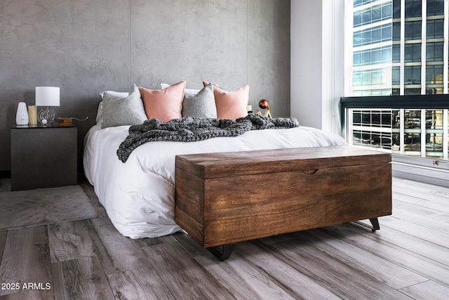 1 E Lexington Ave Unit 1209, Phoenix, AZ 85012 - bedroom featuring wood finished floors and multiple windows