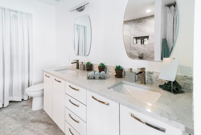 1 E Lexington Ave Unit 1209, Phoenix, AZ 85012 - full bathroom with double vanity, toilet, and recessed lighting