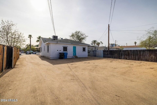 back of property featuring cooling unit