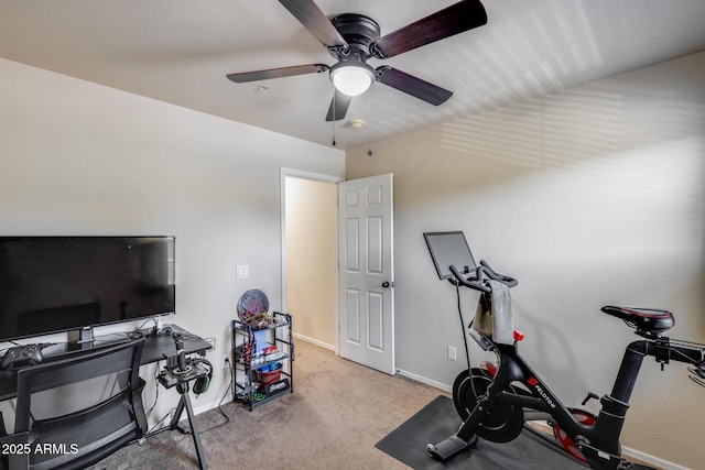 workout room featuring carpet floors, baseboards, and a ceiling fan