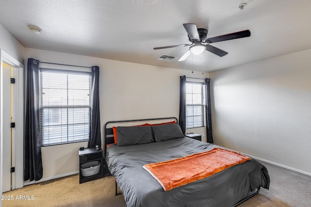 bedroom with visible vents, baseboards, and carpet floors