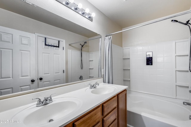 full bathroom featuring shower / bath combo with shower curtain, a sink, and double vanity
