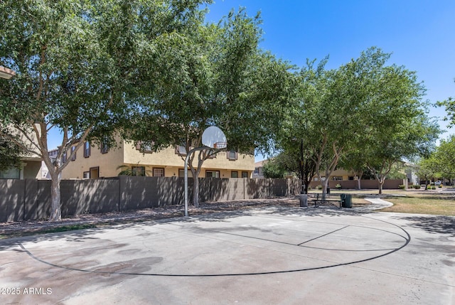 view of sport court featuring fence and community basketball court