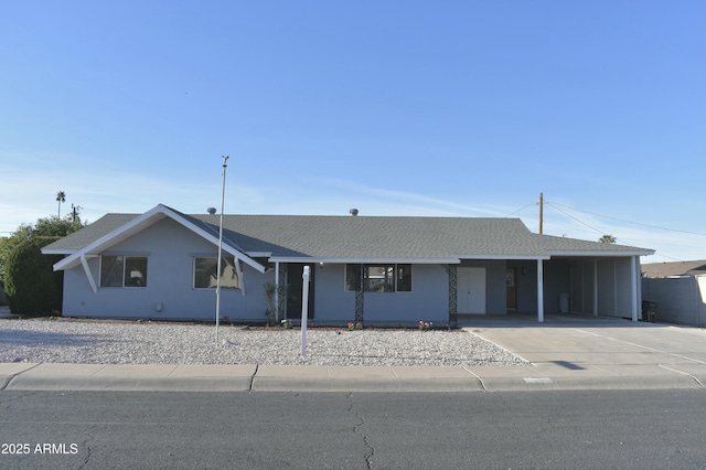 single story home featuring a carport