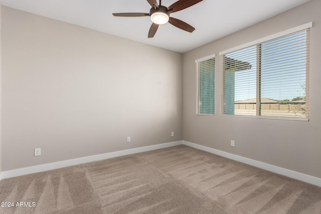 carpeted empty room with ceiling fan