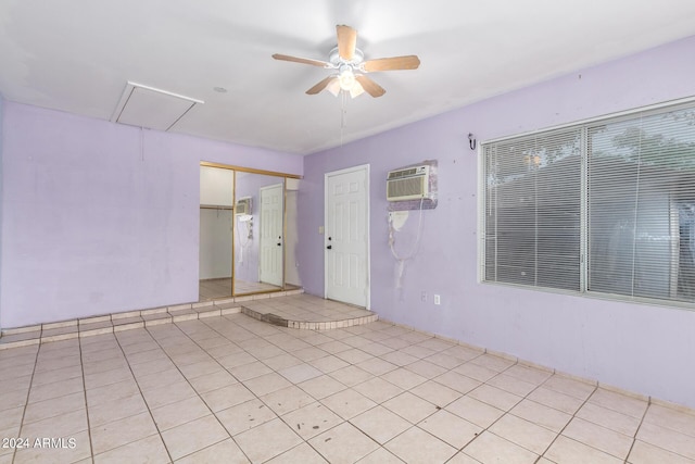 view of patio featuring an AC wall unit and ceiling fan