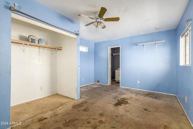 unfurnished bedroom featuring ceiling fan and a closet