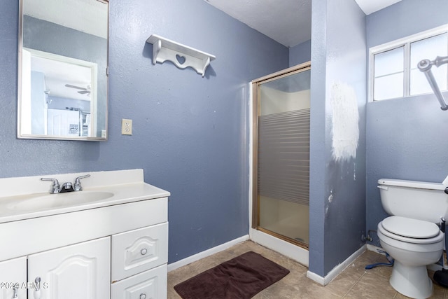 bathroom featuring vanity, an enclosed shower, and toilet