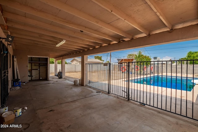 view of patio / terrace with a fenced in pool