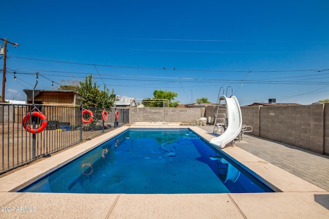 view of pool featuring a water slide