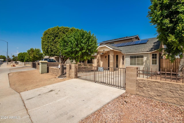 view of front of house featuring solar panels