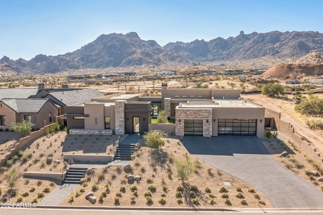 exterior space with a mountain view and a garage