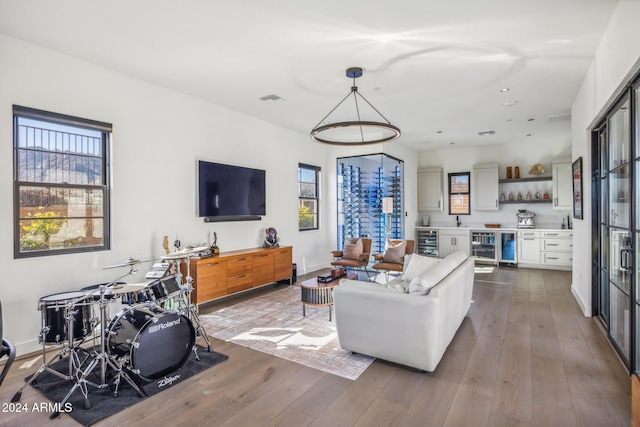 living room featuring beverage cooler and wood-type flooring