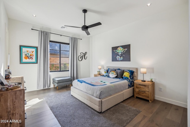 bedroom with hardwood / wood-style flooring and ceiling fan