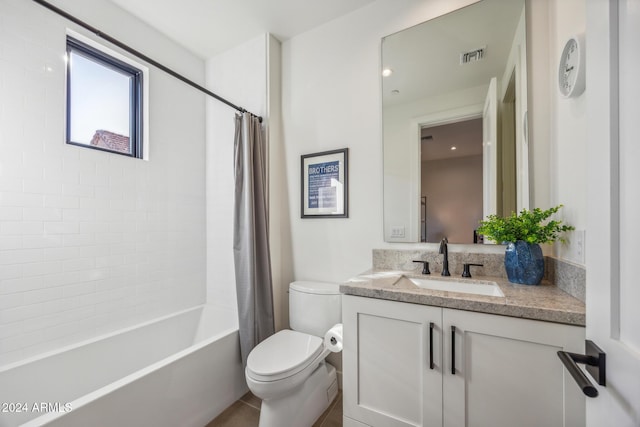 full bathroom featuring tile patterned flooring, vanity, toilet, and shower / bath combo