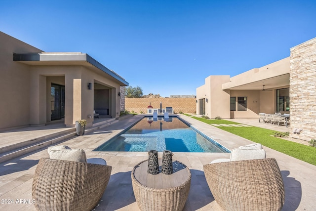 view of swimming pool with a patio