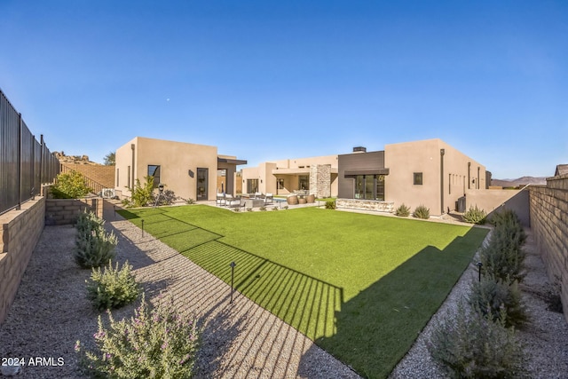 view of yard with outdoor lounge area and a patio