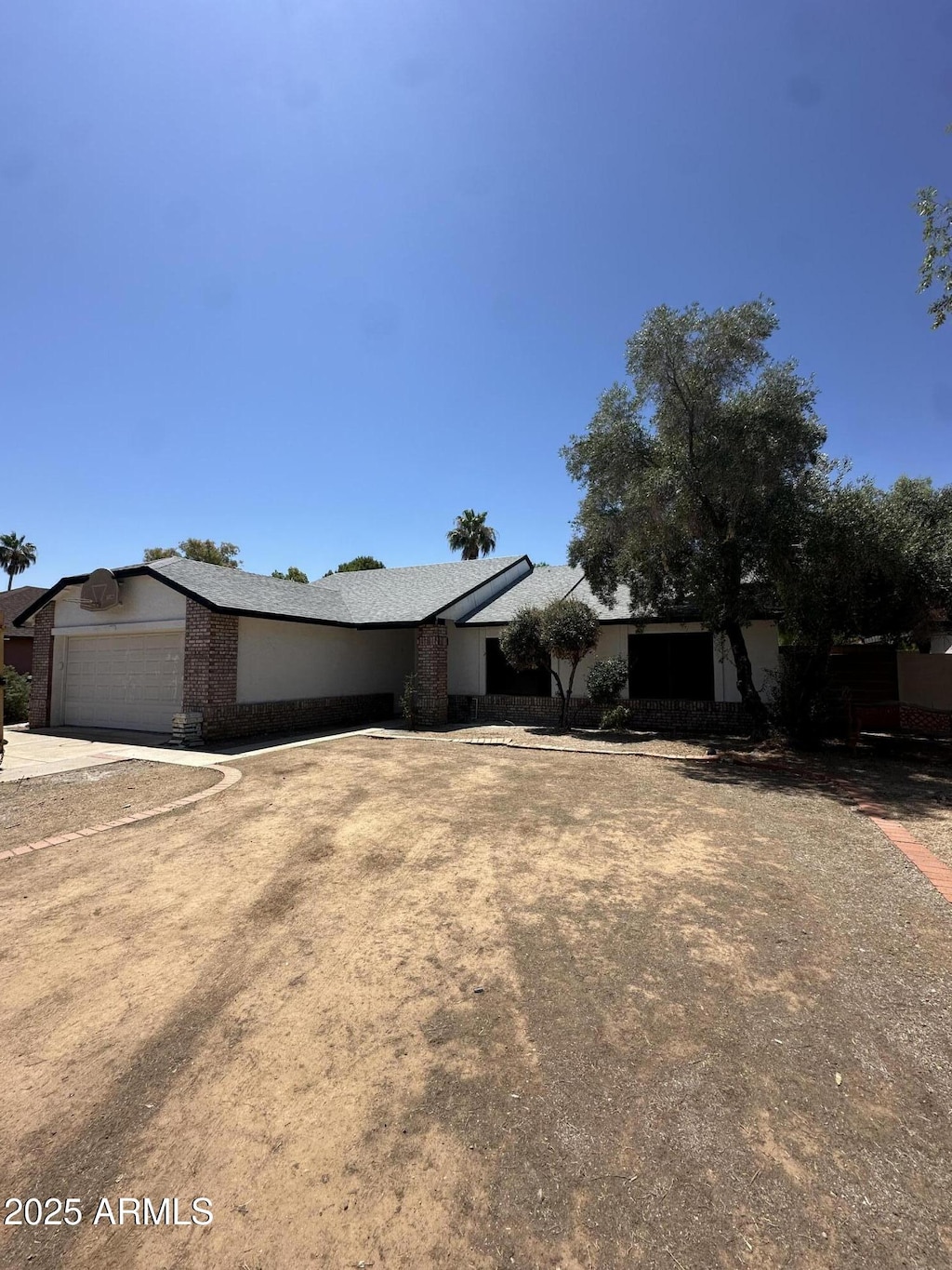 4219 E Whitney Ln, Phoenix, AZ 85032 - view of front facade with a garage and driveway