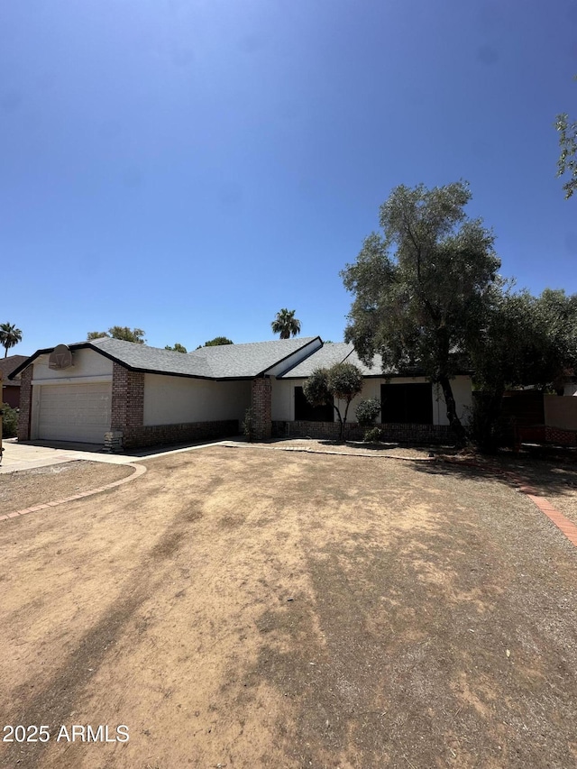 4219 E Whitney Ln, Phoenix, AZ 85032 - view of front facade with a garage and driveway