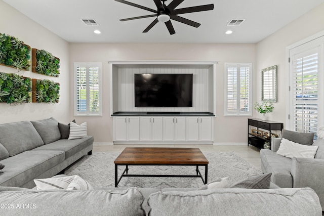 living room with recessed lighting, visible vents, and ceiling fan