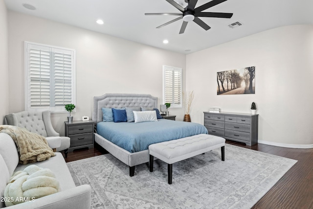 bedroom with recessed lighting, visible vents, baseboards, and wood finished floors