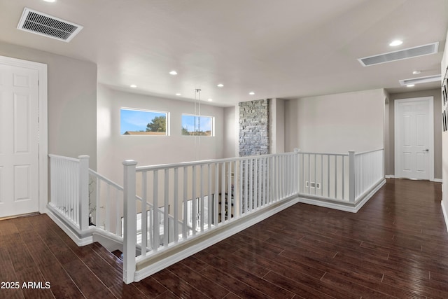 corridor featuring visible vents, wood finished floors, and recessed lighting