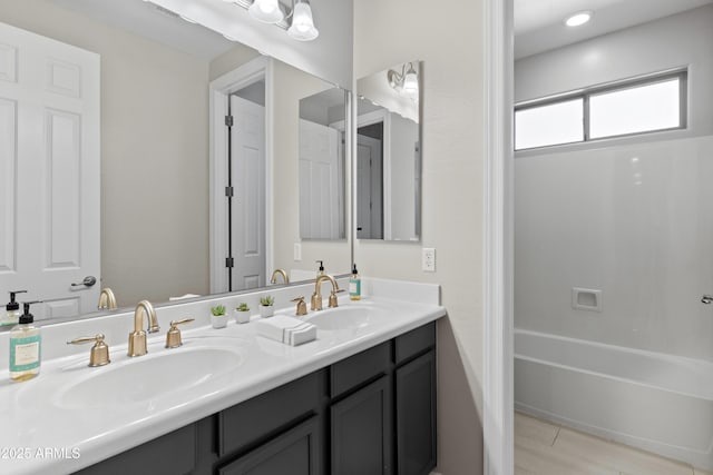 bathroom with double vanity and a sink