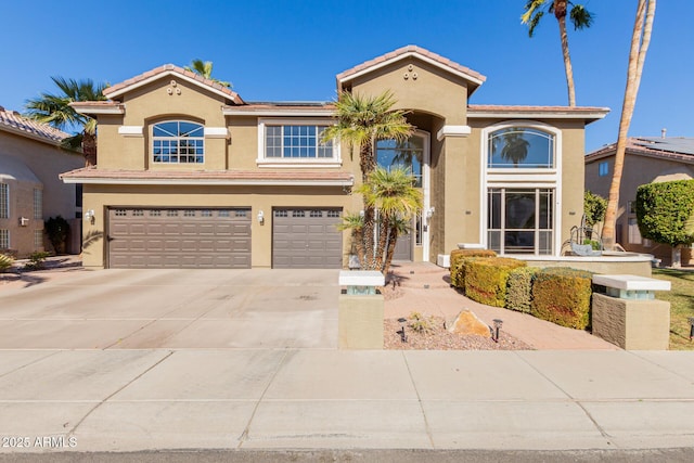 mediterranean / spanish-style house featuring a garage