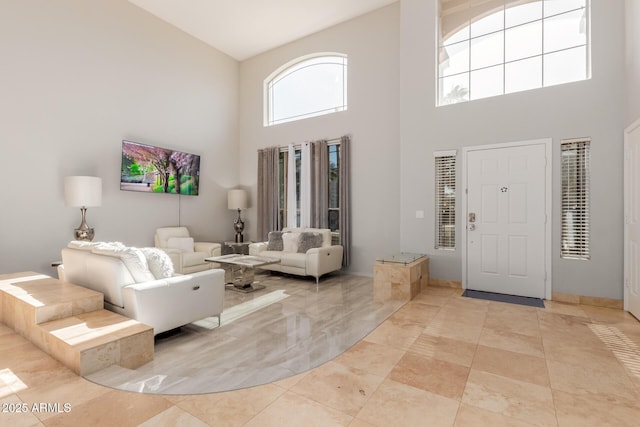 entrance foyer featuring a towering ceiling