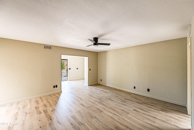 unfurnished room with light hardwood / wood-style flooring, ceiling fan, and a textured ceiling