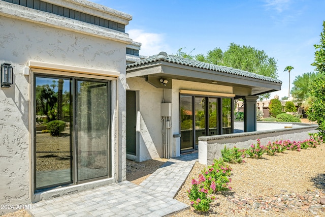 entrance to property with a patio area