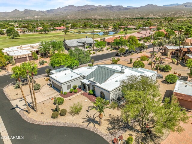 birds eye view of property with a mountain view