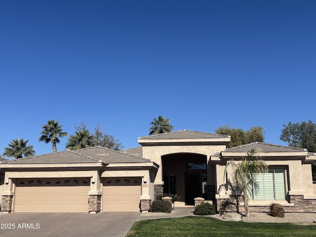 view of front facade with a garage and a front lawn