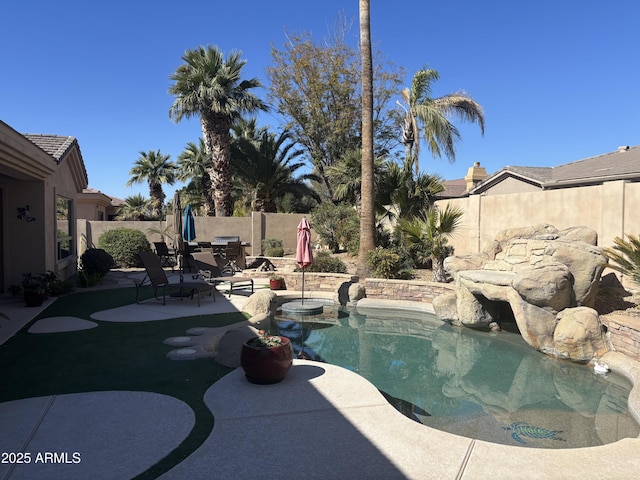 view of swimming pool with a patio