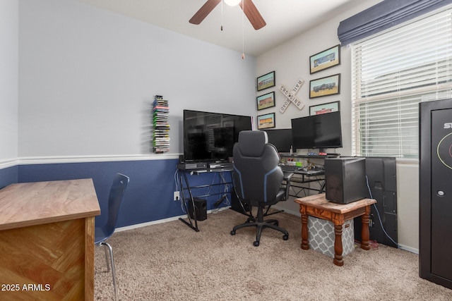 carpeted home office with a ceiling fan and baseboards