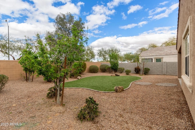 view of yard with a fenced backyard
