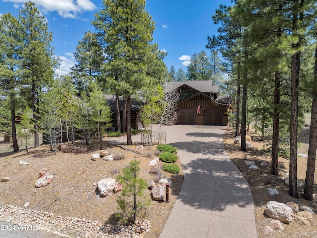 rustic home featuring driveway