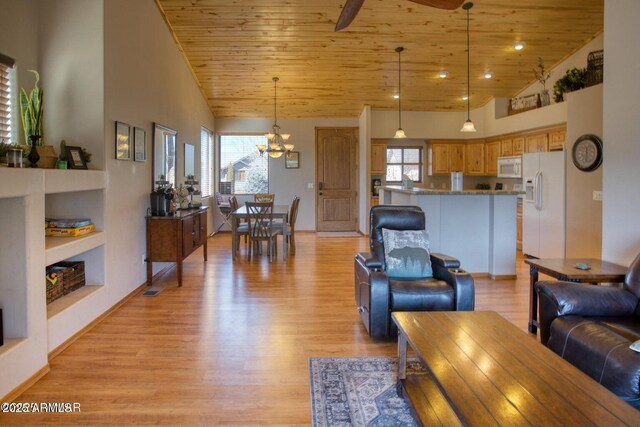 living area featuring light wood-style floors, built in shelves, wooden ceiling, and ceiling fan with notable chandelier