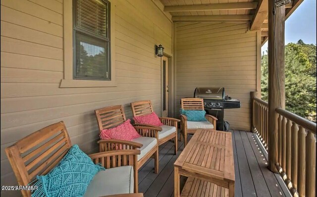 balcony featuring an outdoor hangout area and a grill