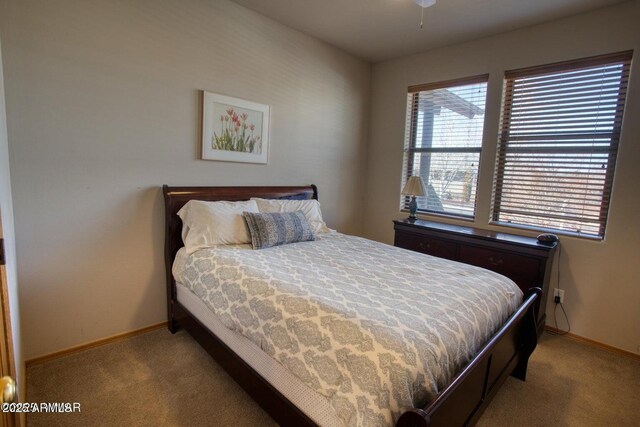 bedroom with baseboards and carpet flooring