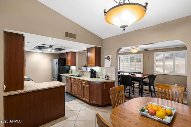 kitchen featuring visible vents, appliances with stainless steel finishes, light tile patterned flooring, a sink, and ceiling fan