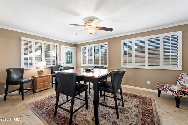 dining area featuring ornamental molding and light tile patterned flooring