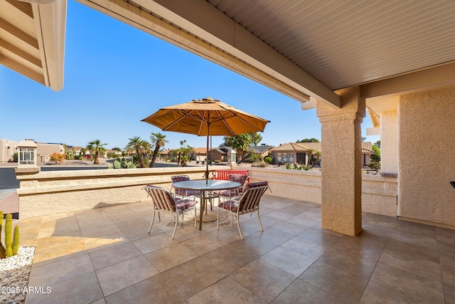 view of patio / terrace with a residential view and outdoor dining area