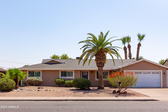 ranch-style home featuring a garage